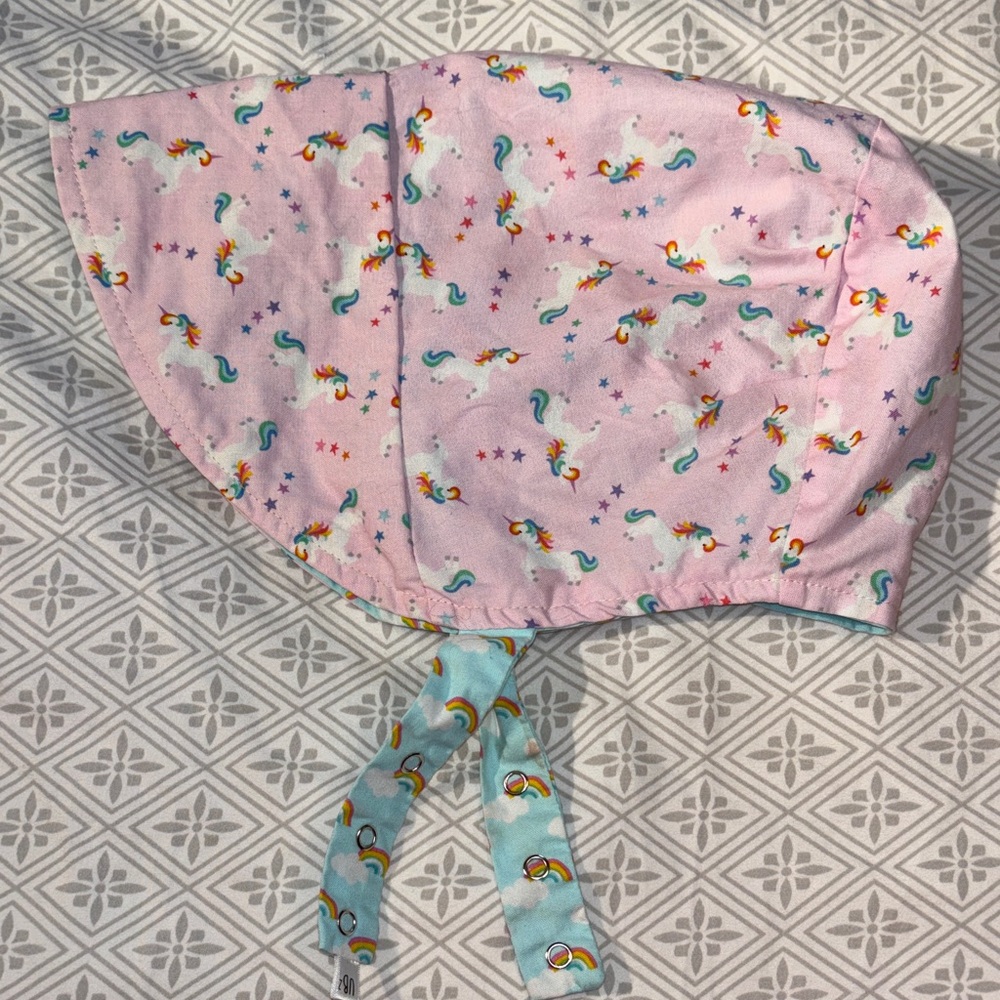 Urban baby bonnet reversible organic cotton bonnet in rainbow unicorns. UB2
